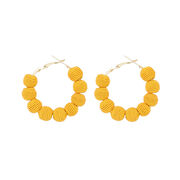 Yellow woven ball hoop earrings